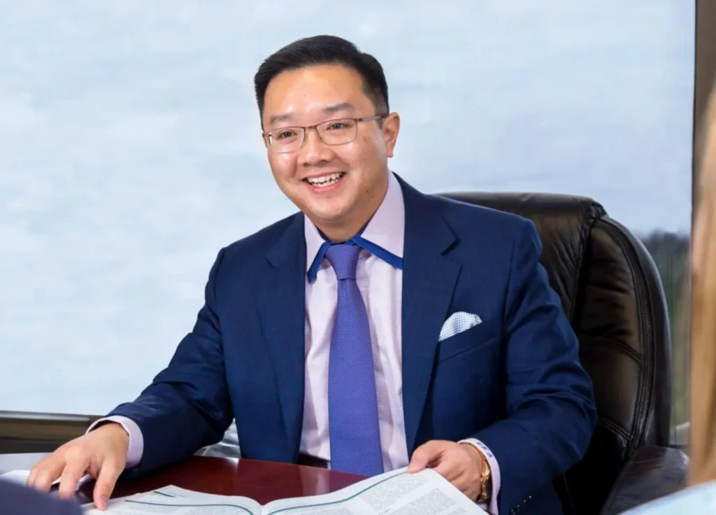 CLAYTON K. SHUM